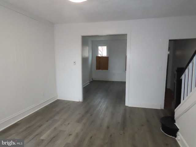 spare room with dark hardwood / wood-style floors