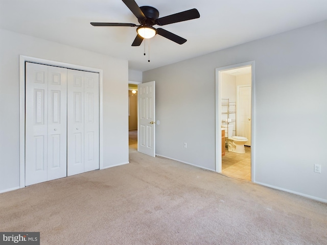 unfurnished bedroom with light carpet, connected bathroom, ceiling fan, and a closet