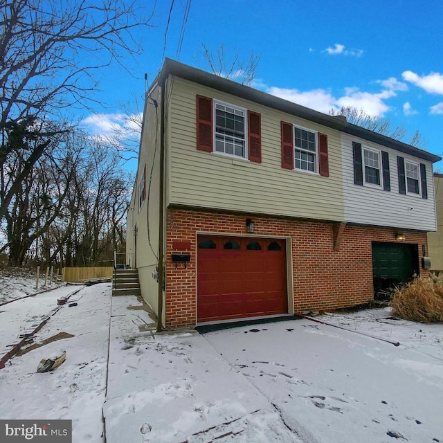 view of front of property with a garage