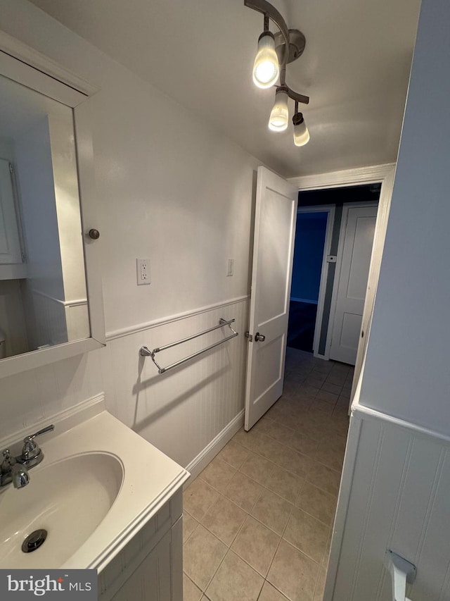 bathroom featuring tile patterned flooring and vanity