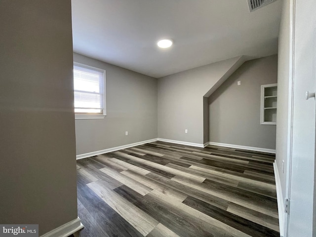 empty room featuring dark hardwood / wood-style flooring