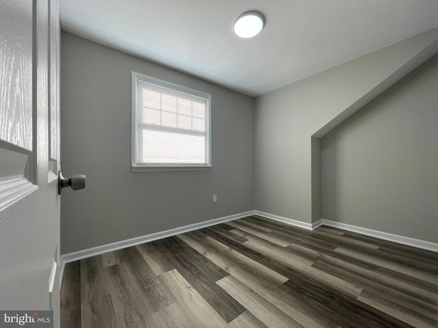 empty room featuring dark wood-type flooring