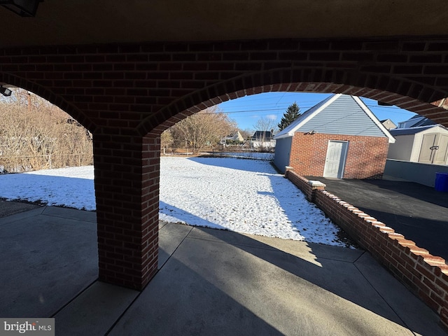 view of patio / terrace featuring a shed