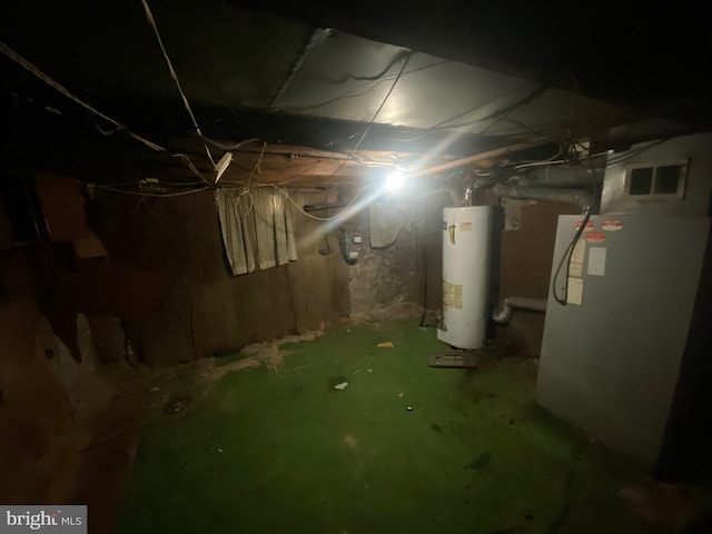 basement with gas water heater and heating unit