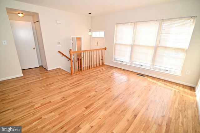 unfurnished room featuring light hardwood / wood-style floors