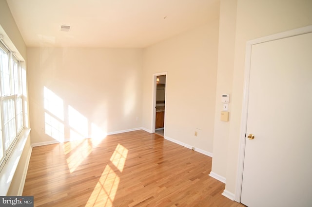 spare room featuring light wood-type flooring