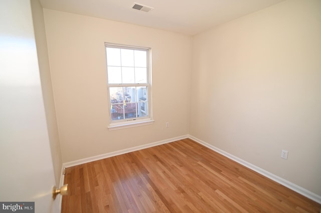 unfurnished room with light hardwood / wood-style flooring