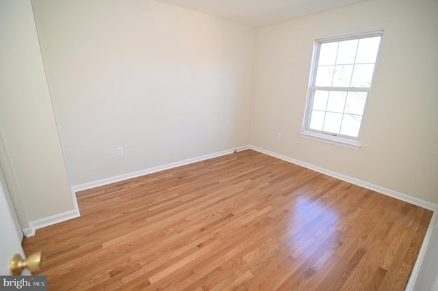 empty room featuring light hardwood / wood-style floors and a healthy amount of sunlight