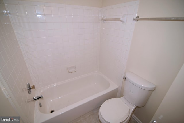 bathroom with shower / bathing tub combination and toilet