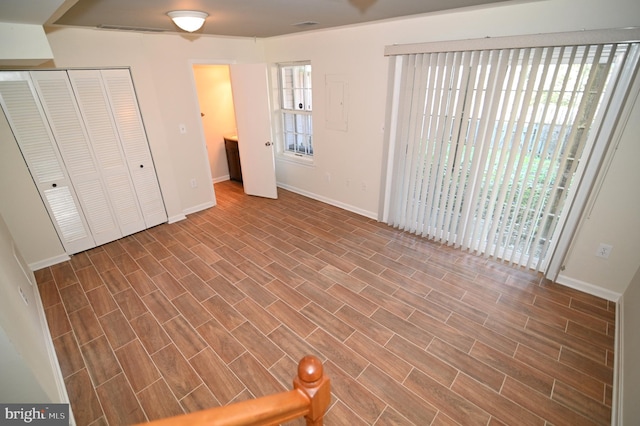 unfurnished bedroom featuring hardwood / wood-style flooring and a closet