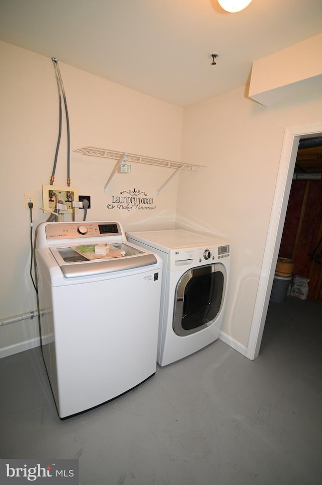 washroom featuring washer and dryer