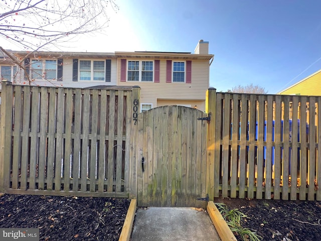 view of gate with fence