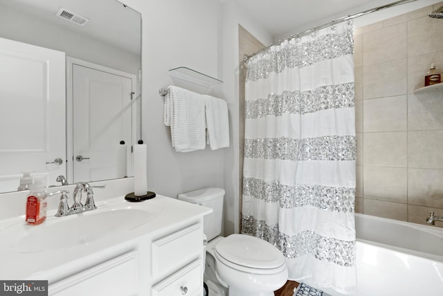 full bathroom with vanity, toilet, and shower / bath combo with shower curtain