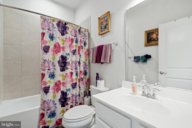 full bathroom featuring shower / bath combo, vanity, and toilet