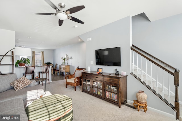 living room featuring ceiling fan and light carpet