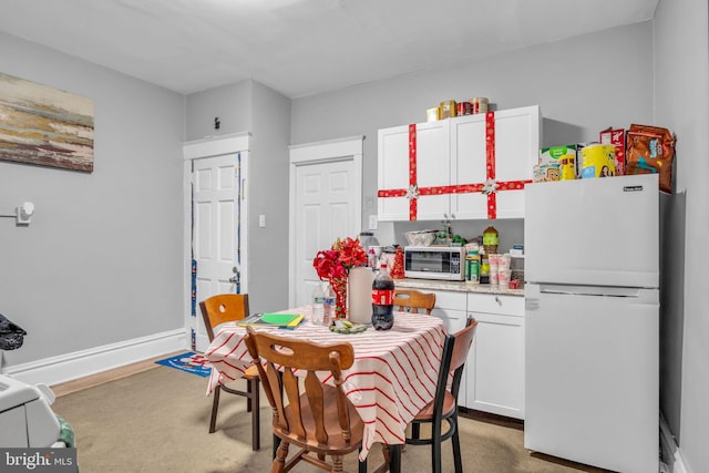 dining area with carpet flooring