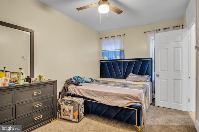 bedroom with ceiling fan and light carpet