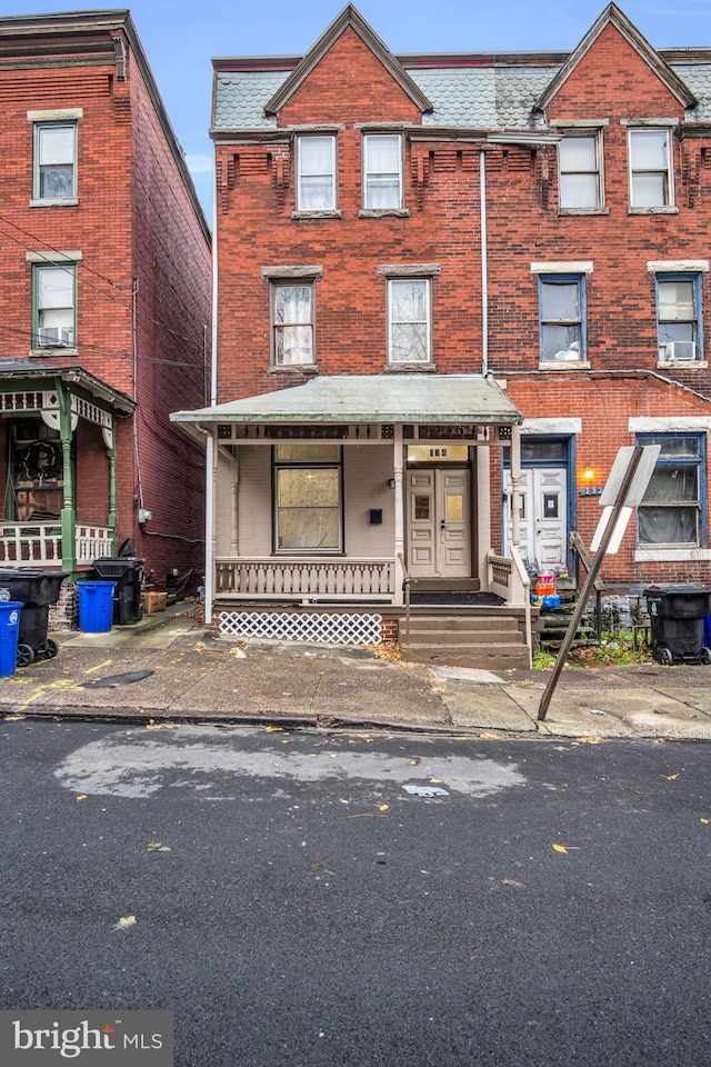 townhome / multi-family property with a porch