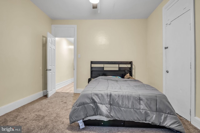 bedroom featuring ceiling fan and light colored carpet