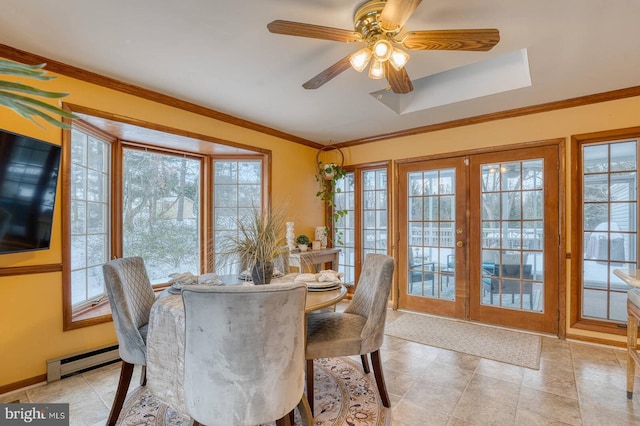 dining space featuring ceiling fan, ornamental molding, baseboard heating, and french doors