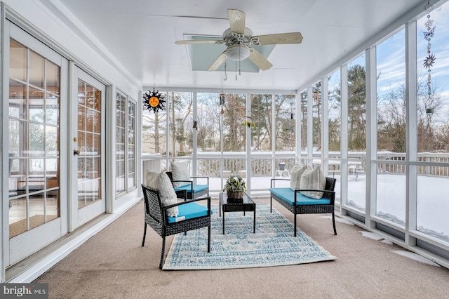 sunroom / solarium featuring ceiling fan