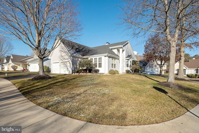 view of home's exterior featuring a lawn and a garage