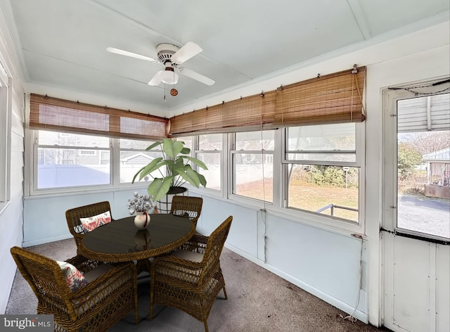 sunroom with ceiling fan and a wealth of natural light