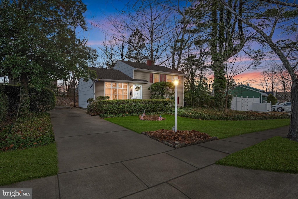 view of front of home with a lawn