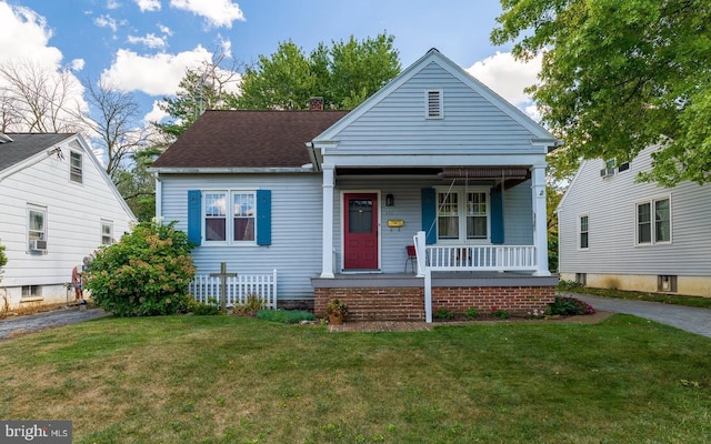 view of front of home featuring a front lawn and a porch