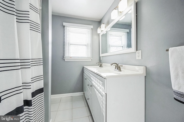 bathroom featuring tile patterned flooring, a shower with curtain, and vanity