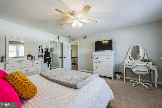 bedroom featuring ceiling fan, a closet, and carpet floors