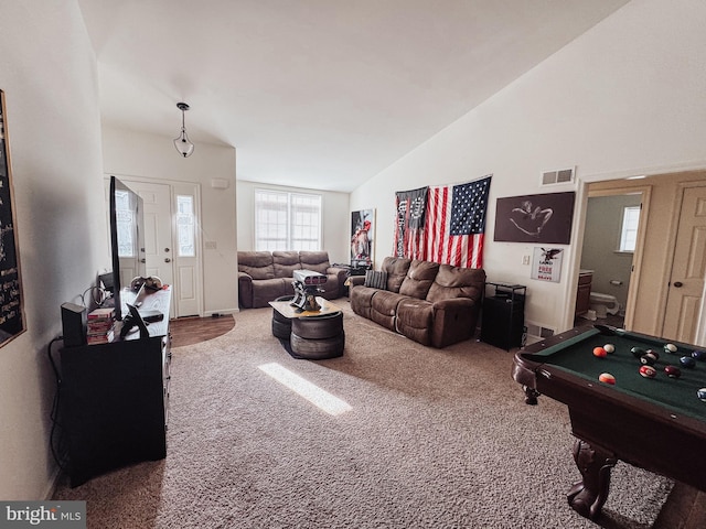 living room featuring carpet floors, lofted ceiling, and pool table