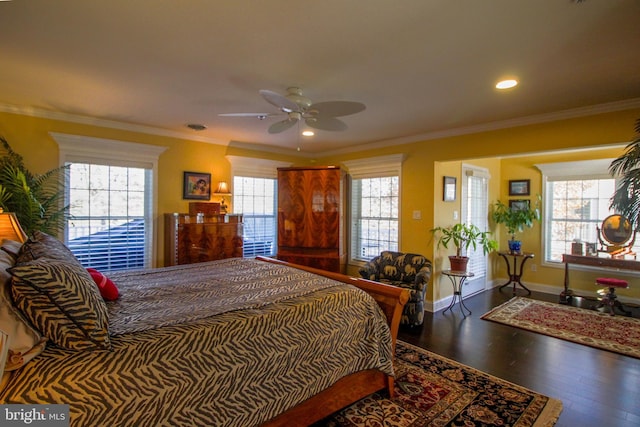 bedroom featuring ceiling fan, wood-type flooring, and crown molding