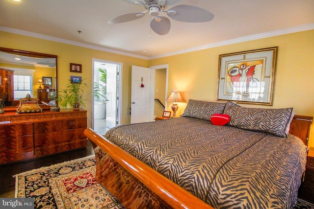 bedroom with hardwood / wood-style floors, ceiling fan, and crown molding