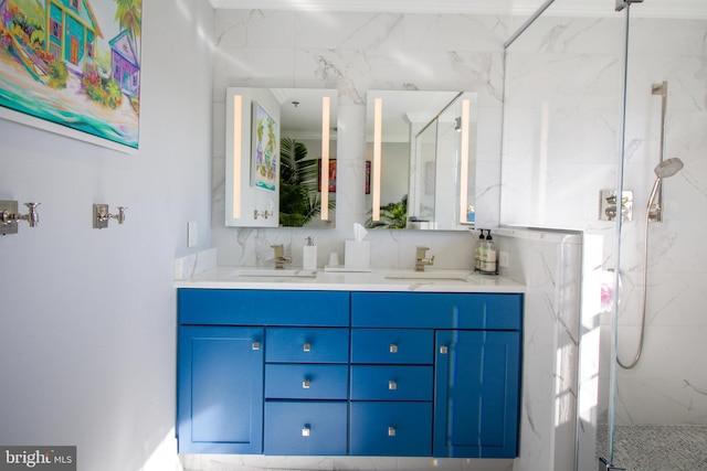 bathroom featuring vanity and a shower with shower door