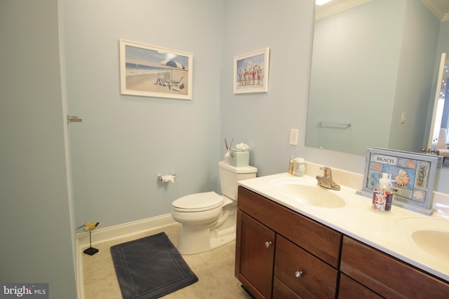 bathroom featuring vanity, toilet, and ornamental molding