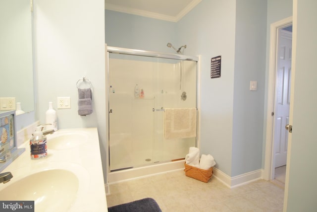 bathroom with crown molding, sink, and walk in shower