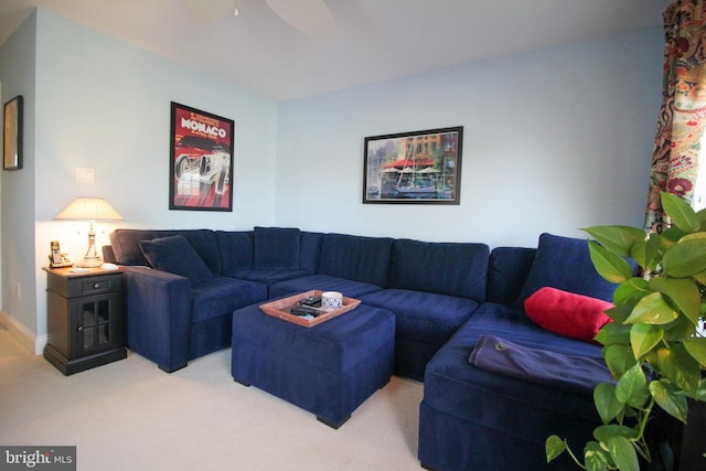 living room with ceiling fan and light colored carpet