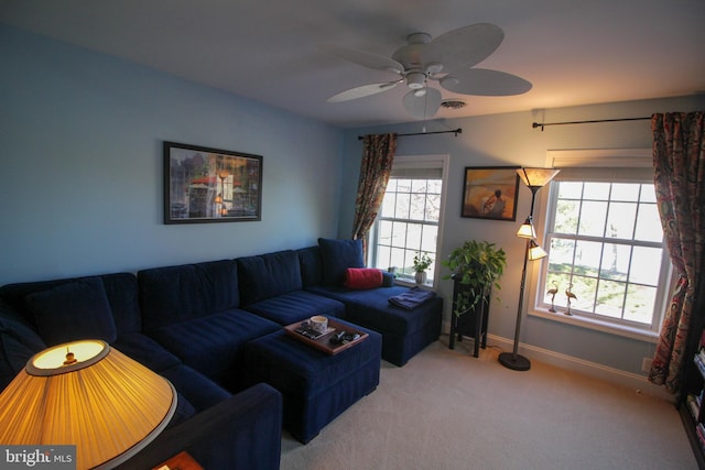 living room with carpet and ceiling fan