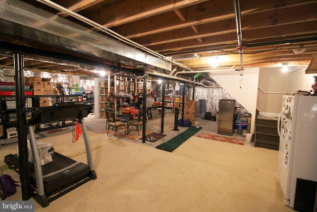 basement featuring white refrigerator