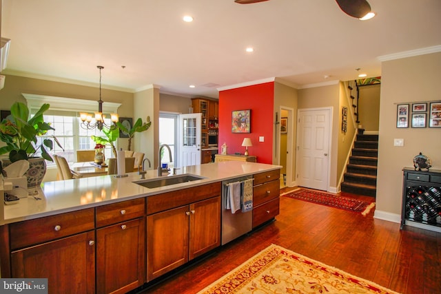 kitchen with dishwasher, dark hardwood / wood-style floors, plenty of natural light, and sink