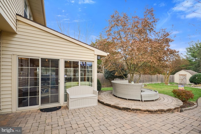 view of patio with a storage shed