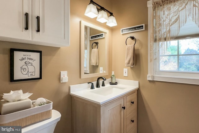 bathroom with vanity and toilet