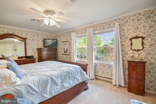 bedroom featuring baseboard heating, light colored carpet, ornamental molding, and ceiling fan