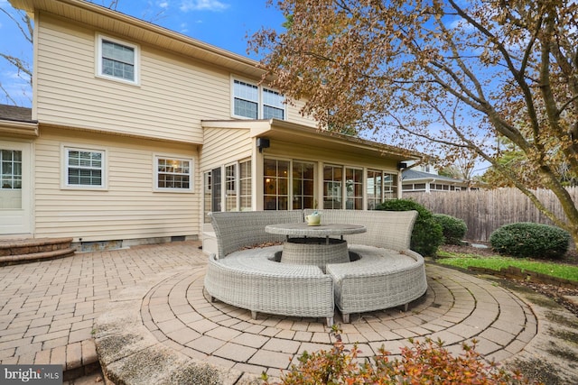 rear view of property featuring a patio area and a sunroom