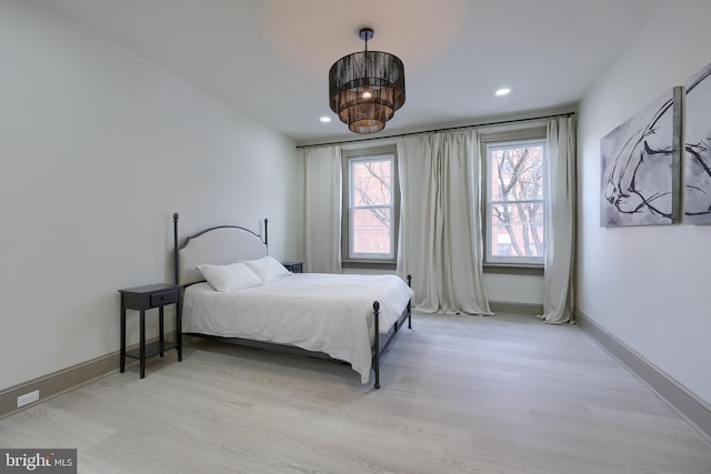 bedroom with light wood-type flooring