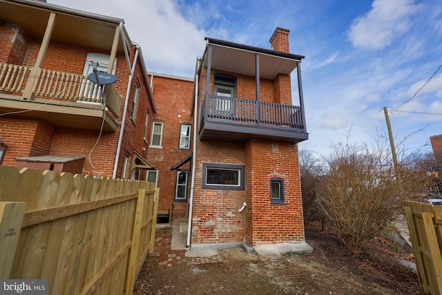 rear view of house with a balcony