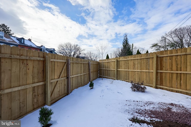 view of yard layered in snow