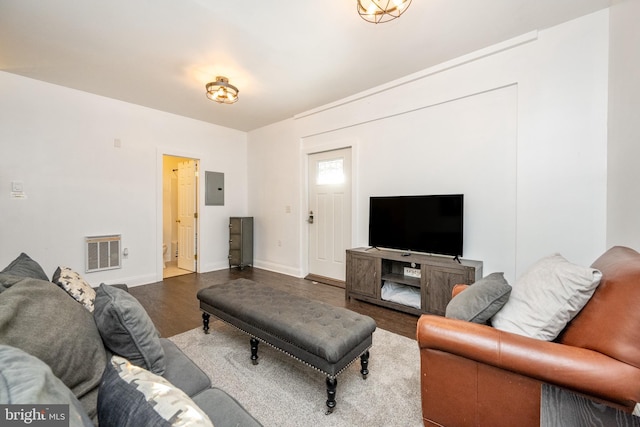 living room with wood-type flooring and electric panel