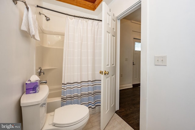 bathroom featuring toilet, shower / tub combo, and tile patterned floors